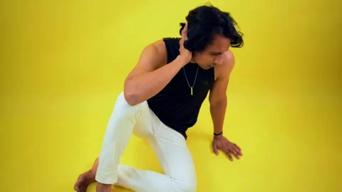 Man sits down hand resting on his head in distress Stock Footage 307898499