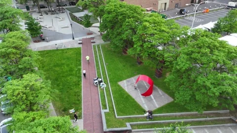 Man Sits on the Edge of Steps Eating - Syracuse, NY 库存影片 336473671