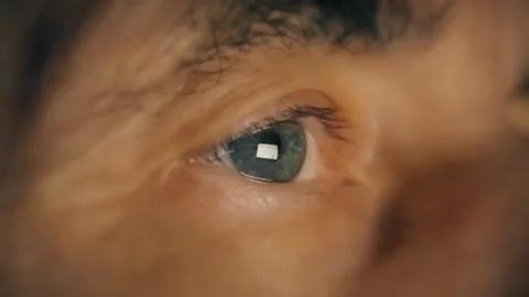 A man sits in front of a computer at night Stock Footage 124184746