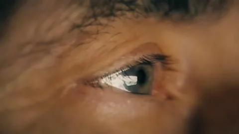 A man sits in front of a computer at night Stock Footage 124631679