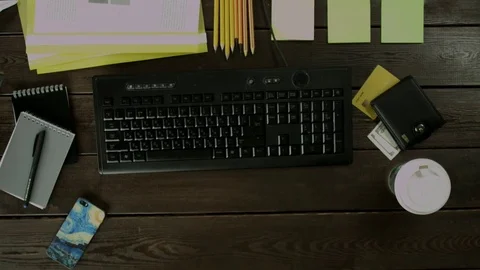 A man sits at the keyboard and click on the arrows and buttons, that change the Stock Footage 82011869