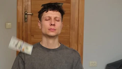 A man sits in a meditation pose, practicing a financial flow ritual while Stock Footage 303893643