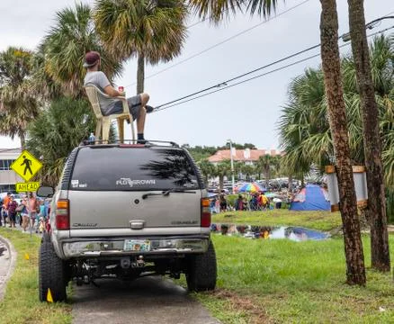 Man sits on roof of truck awaiting launch of SpaceX's Falcon 9 Stock Photos