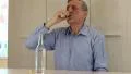 Man sits at the table and drinks vodka HD Footage