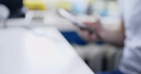 Man sits at table with smartphone and drinks fresh hot drink Stock Footage 105501765