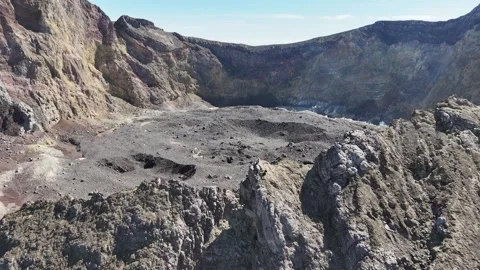 Man sits on the top of Mount Agung, the stratovolcano in Bali, Indonesia Stock Footage 284790573