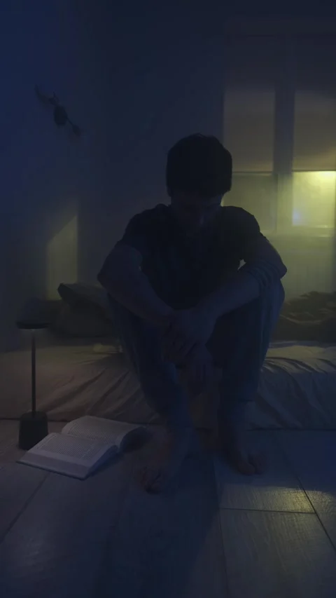 Man sitting alone on bed after relationship breakup, emotional pain and Stock-Footage 320541324