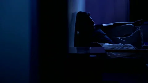 Man sitting alone in the moonlight 스톡 동영상 137333259