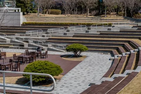 Man sitting alone at table outside. Stock Photos