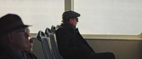 A man sitting alone while traveling by boat in Lisbon Stock Footage 152885851
