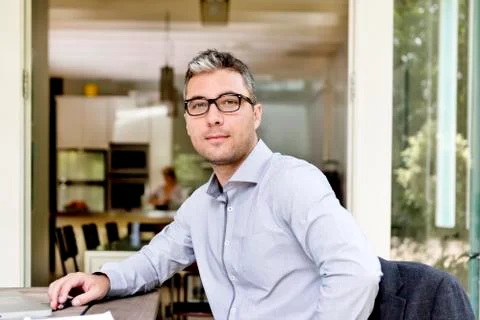 Man sitting and looking at the camera Stock Photos