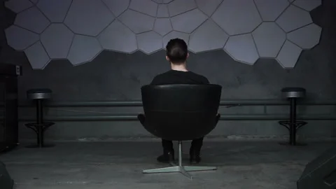 Man is sitting in the armchair Stock Footage 86252844