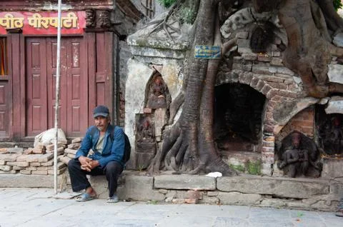 Man Sitting with Backpack Stock Photos