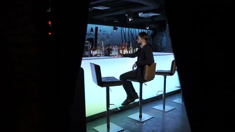 Man is sitting in the bar Stock Footage 86259430