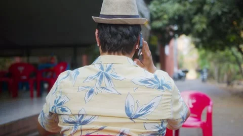Man sitting at the bar talking on cell phone in Brasília, Brazil Stock Footage 286151305