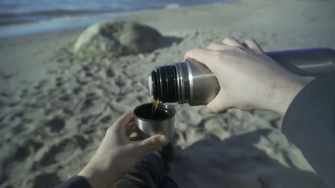 Man sitting on the beach and drinking tea. Point of View Shot. POV video. Stock-Footage 239871121