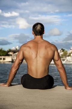 Man sitting on beach and thinking Stock Photos