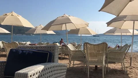 Man sitting on the beach Stock Footage 143115540