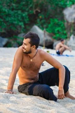 Man sitting on a beach 写真素材
