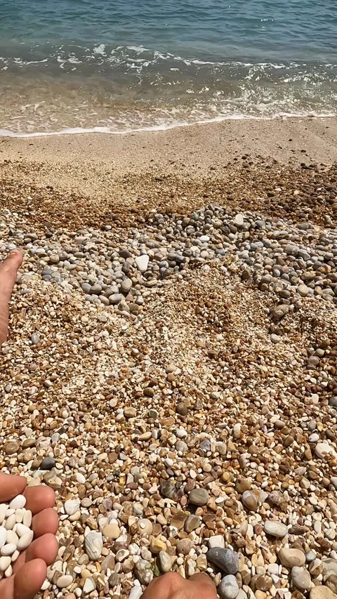 Man Sitting on the Beach Playing Stock Footage 199123772