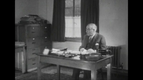 Man sitting behind a desk with papers, Scotland, United Kingdom, UK, 1948 Stock Footage 134037695