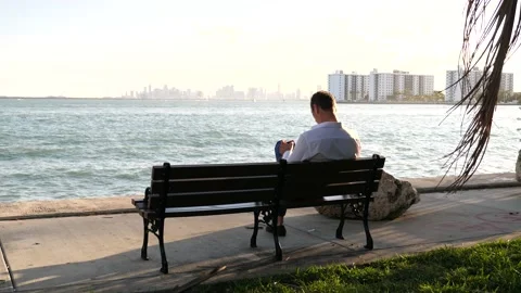 Man Sitting On Bench Overlooking Miami Beach Biscayne Bay Afternoon Stock Footage 150603334