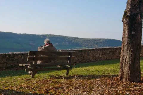 Man sitting on a bench Stock Photos