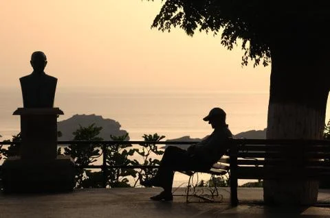 Man sitting on a bench Stock Photos