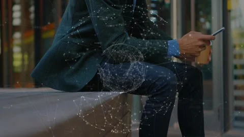 Man sitting on bench in urban building tapping phone creating finance chart Stock Footage 330144159