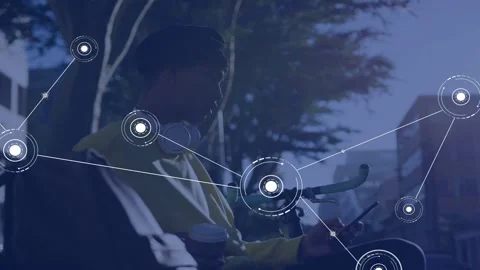 Man sitting on bench using smartphone, initiating HUD nodes pulsing, showing Stock Footage 335731997