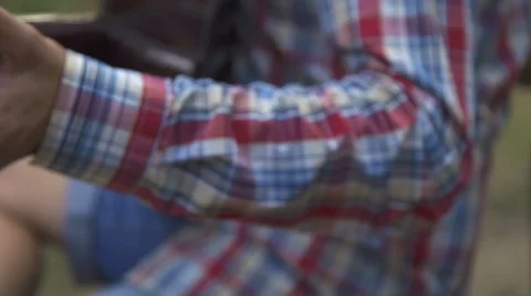 Man sitting on a bench while playing his Guitar Stock Footage 66883810