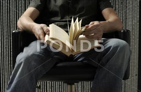 Man Sitting With Book, Mid Section
