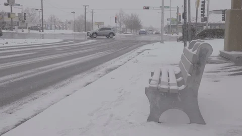 Man Sitting at Bus Stop in the Snow Stock Footage 103701092