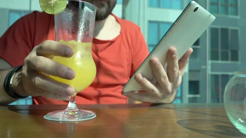 Man sitting in the cafe and browsing internet on tablet Stock Footage 88540836