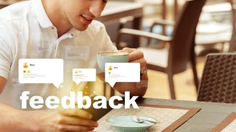 Man sitting in a cafe drinking coffee while looking at feedback on his device Stock Photos