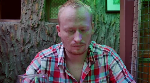 A Man Sitting in a Cafe Stock Footage 65002416