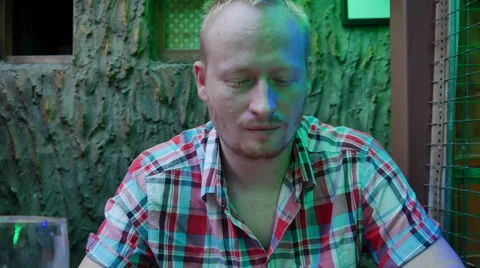 A Man Sitting in a Cafe Stock Footage 65002438