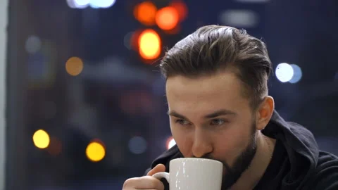 Man is sitting in cafe Stock Footage 86383305