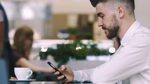 Man sitting in cafe Stock Footage 97056018