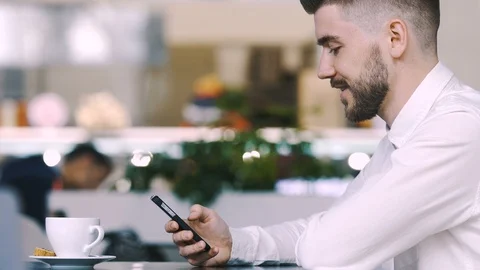 Man sitting in cafe Stock Footage 97058957