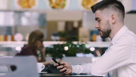 Man sitting in cafe Stock Footage 97063142