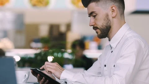 Man sitting in cafe Stock Footage 97071497