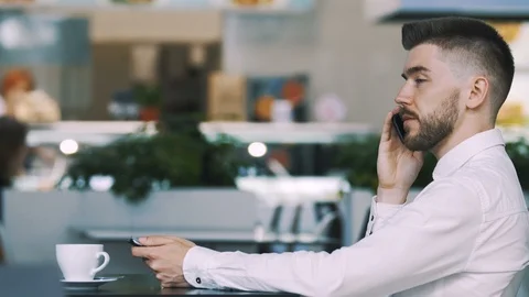 Man sitting in cafe Stock Footage 97081089