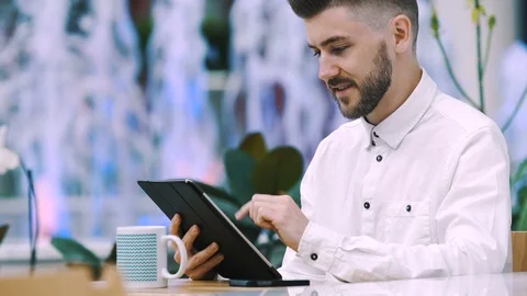 Man sitting in cafe Stock Footage 97090387