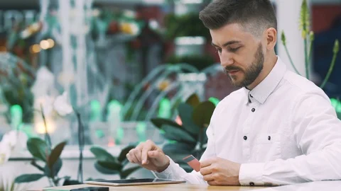 Man sitting in cafe Stock Footage 97093653