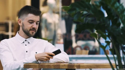 Man sitting in cafe Stock Footage 97096079