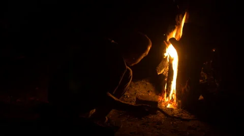 Man Sitting by a Camp Fire 스톡 동영상 66323552