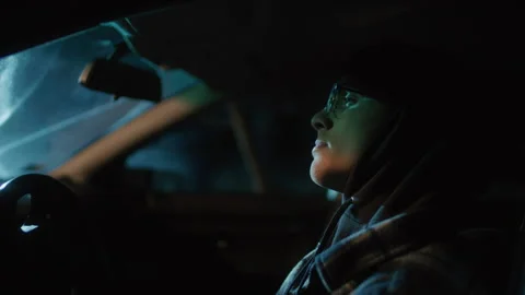 Man Sitting in the Car in the Dark Stock Footage 258452288