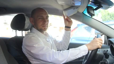 A man sitting in a car Stock Footage 135606456