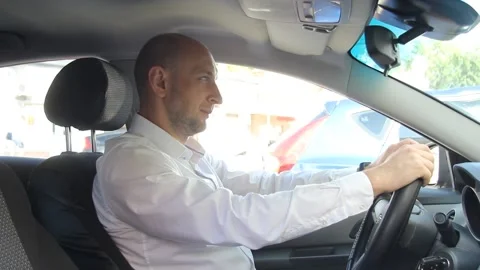 A man sitting in a car Stock Footage 135606482